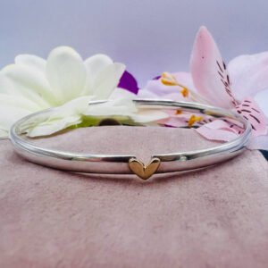 silver bangle with gold heart