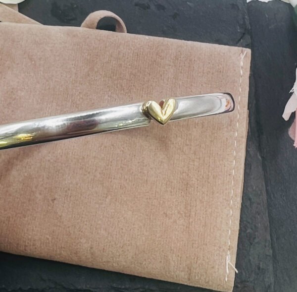 silver bangle with gold heart